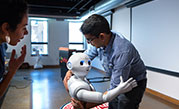 Pepper the robot with student